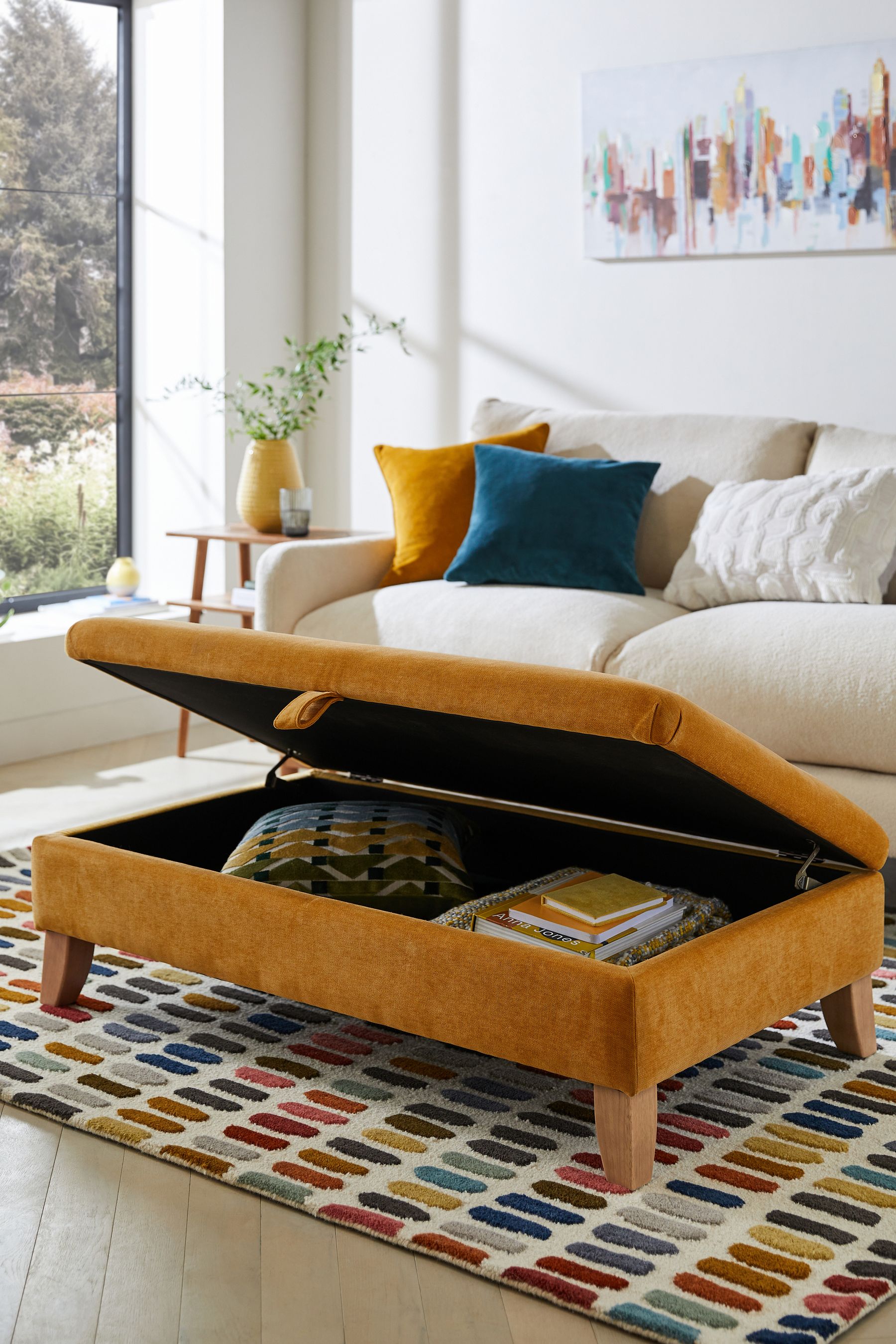 Ochre footstool deals with storage