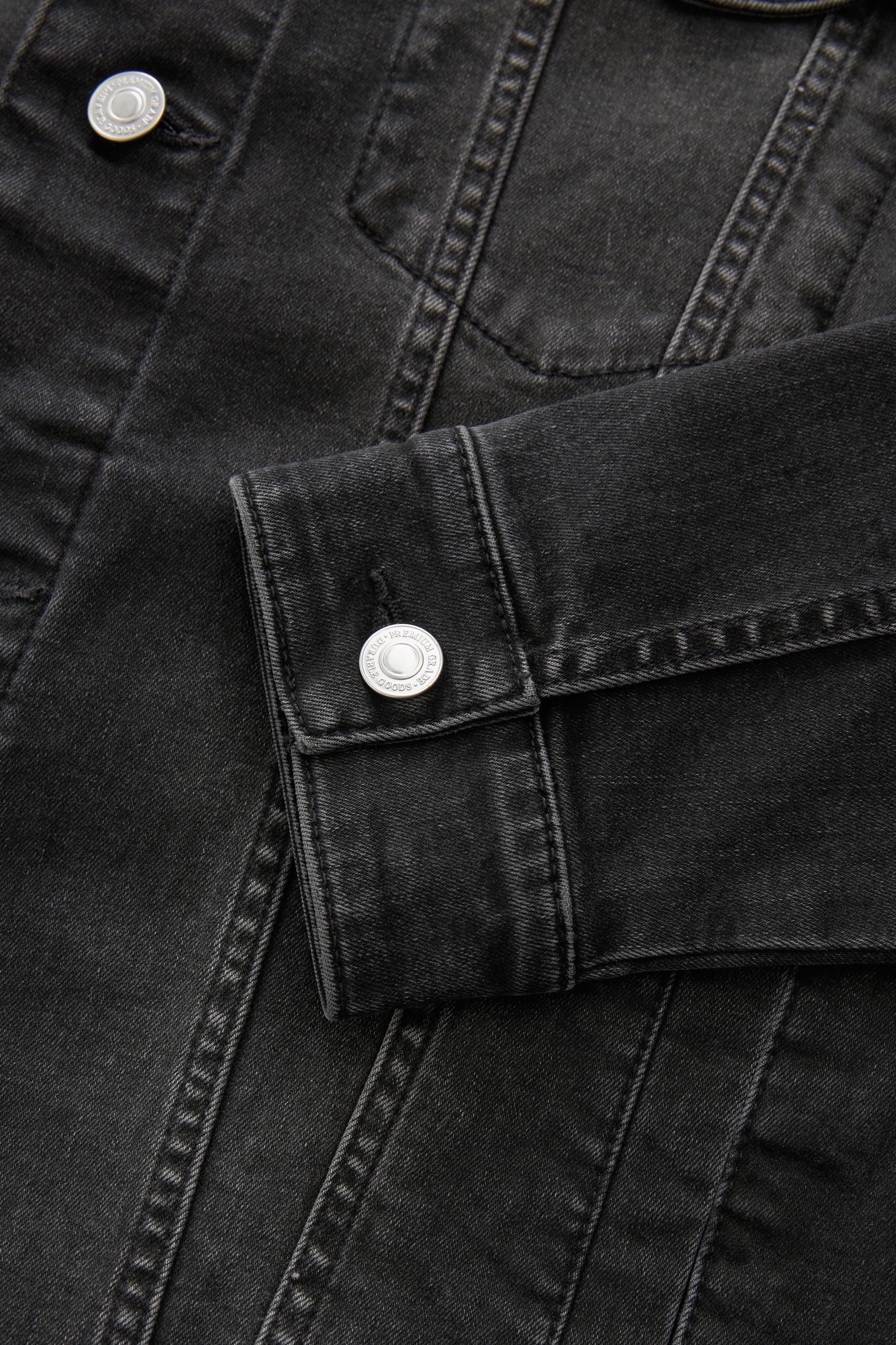 Black denim jacket in store sales