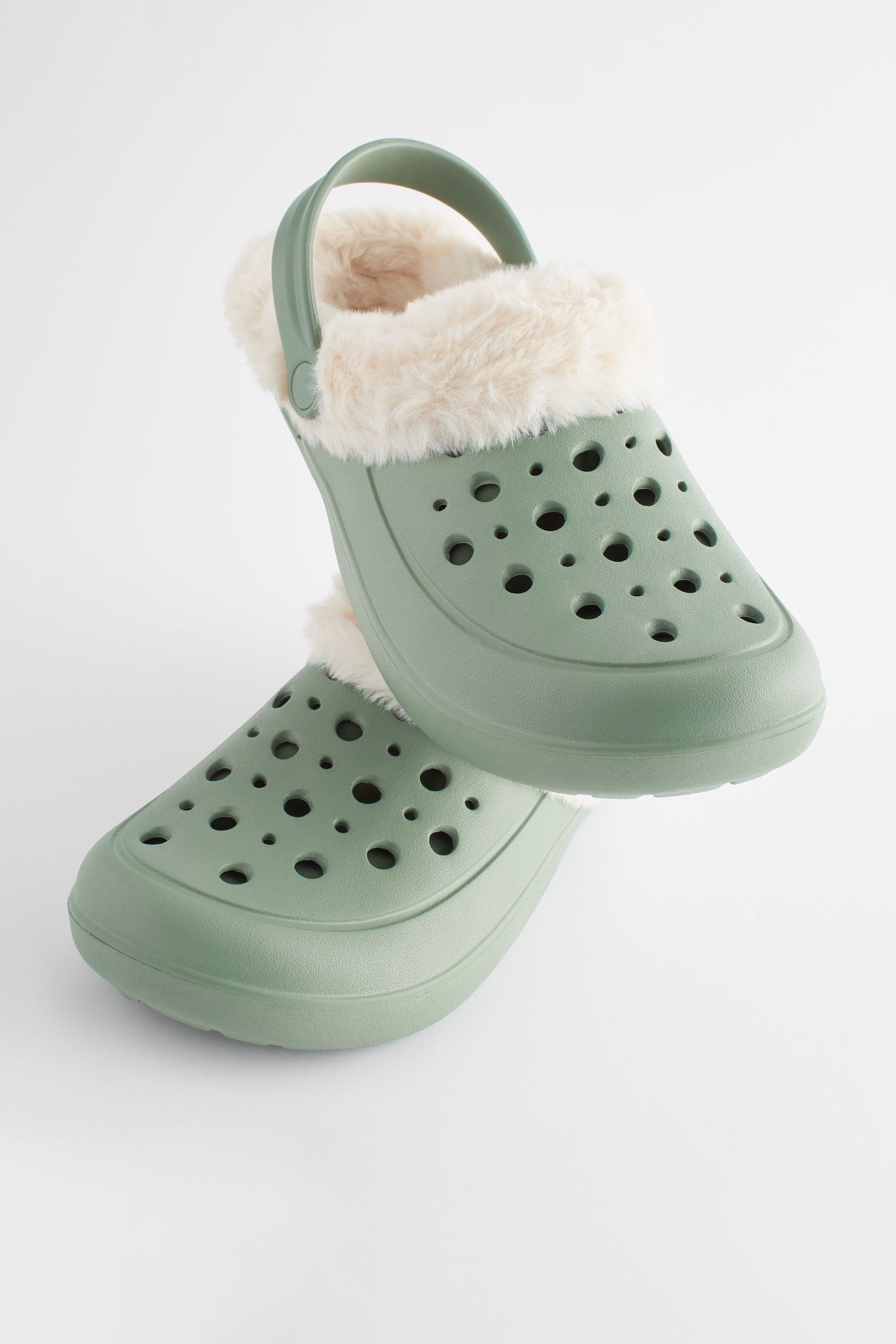 Green crocs shop with fur
