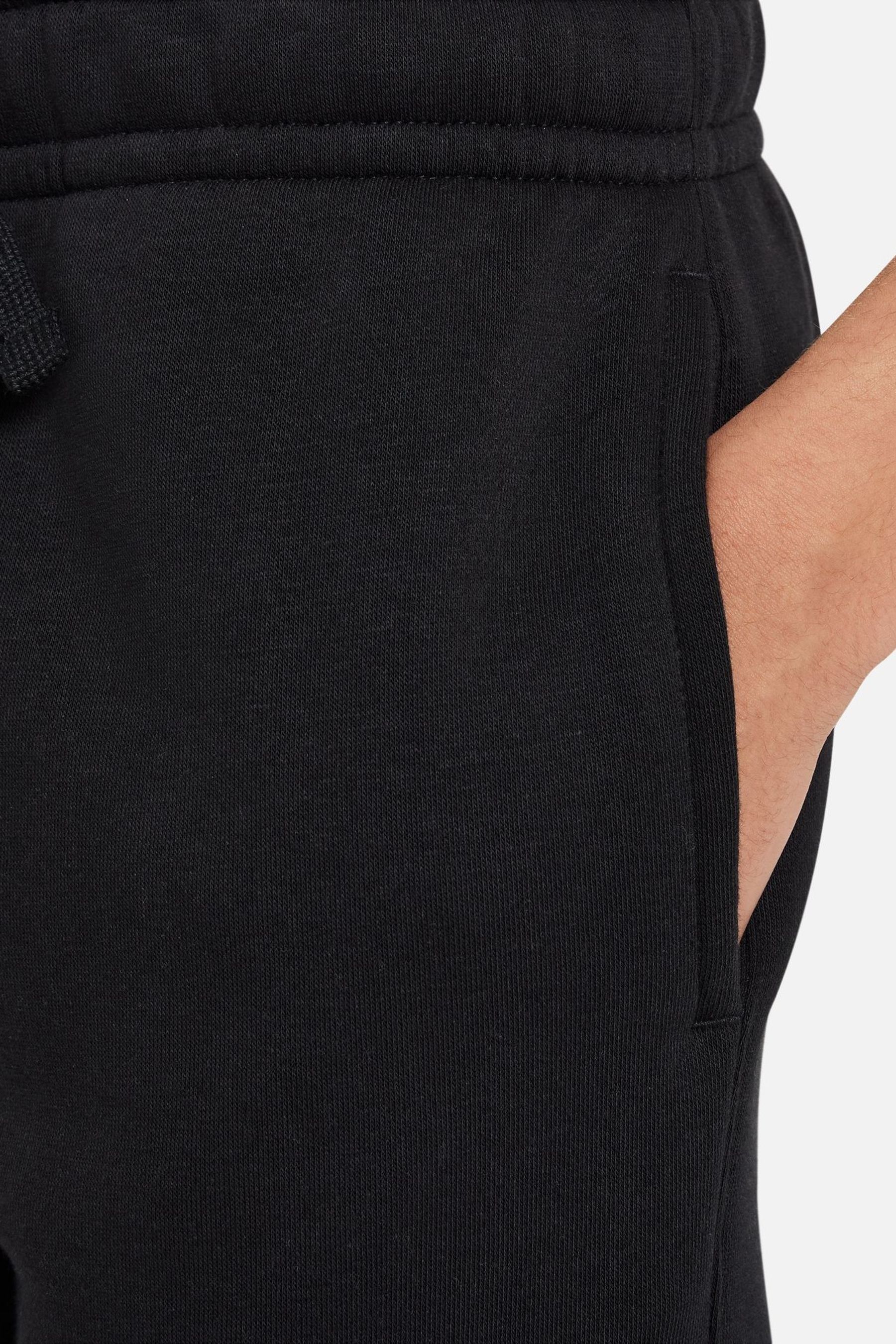 Buy Nike Black Swoosh Fleece Cargo Joggers from the Next UK online
