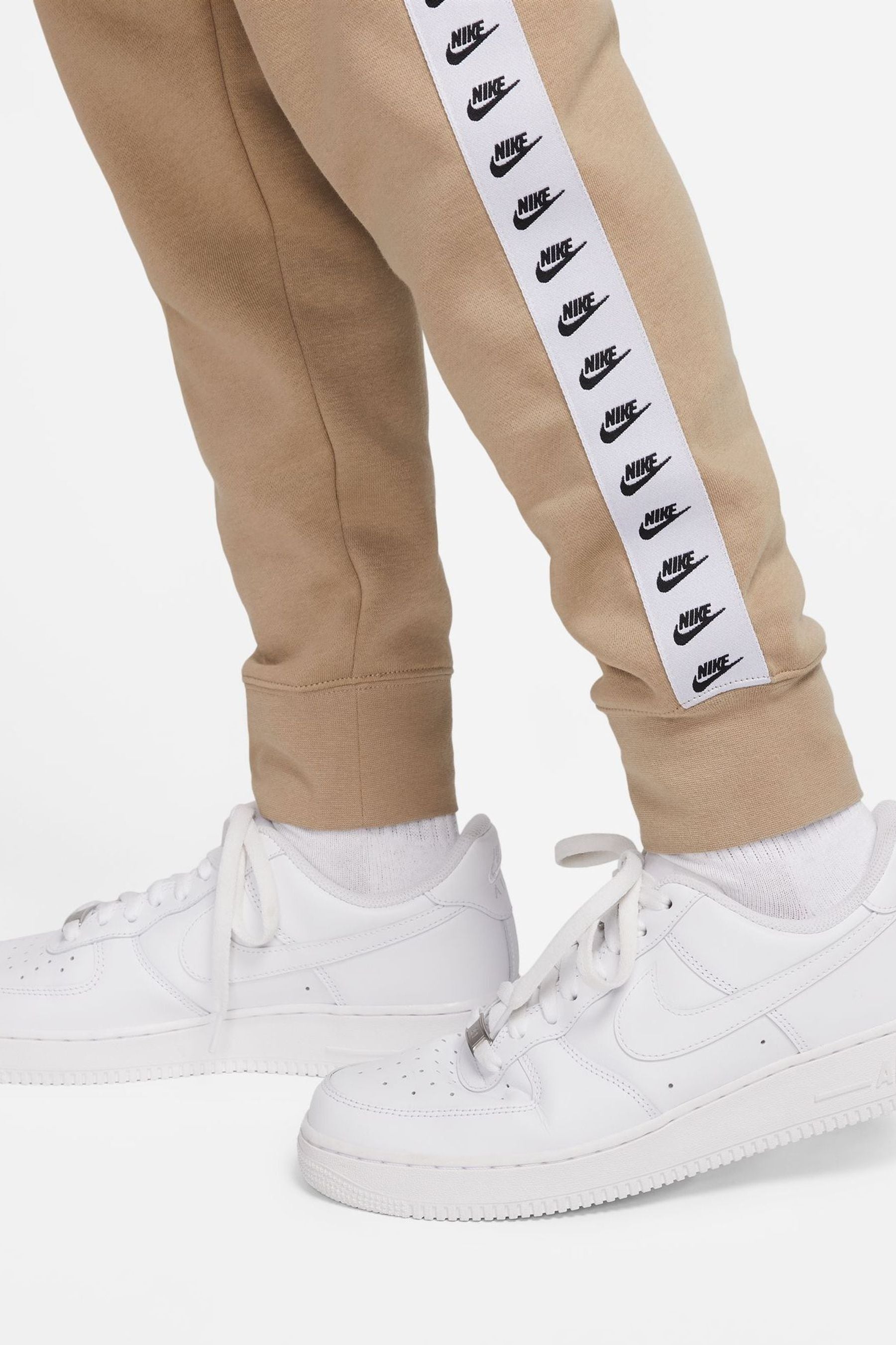 Nike essential beige sales tracksuit