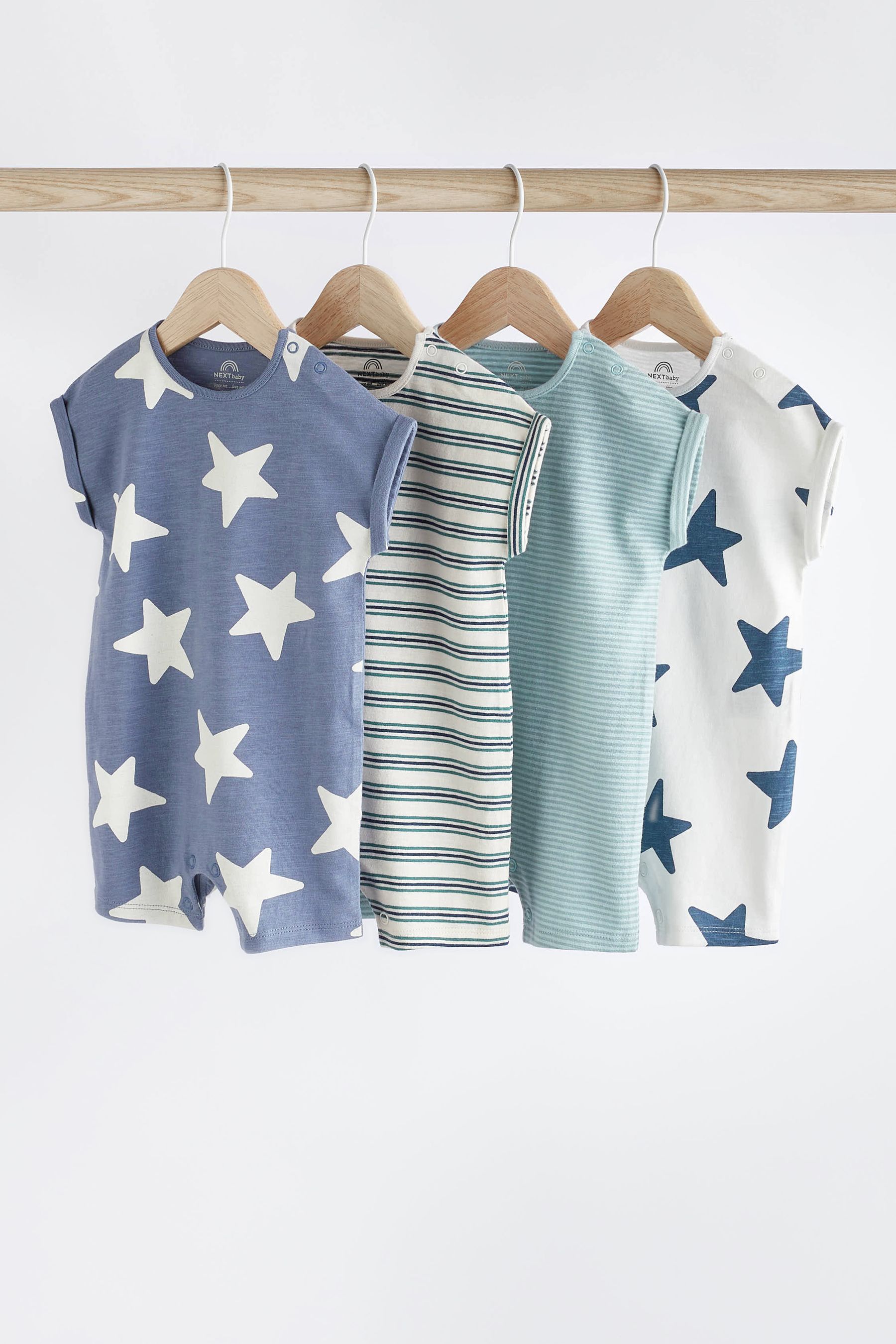 Buy Teal Blue Star Jersey Baby Rompers 4 Pack from the Next UK