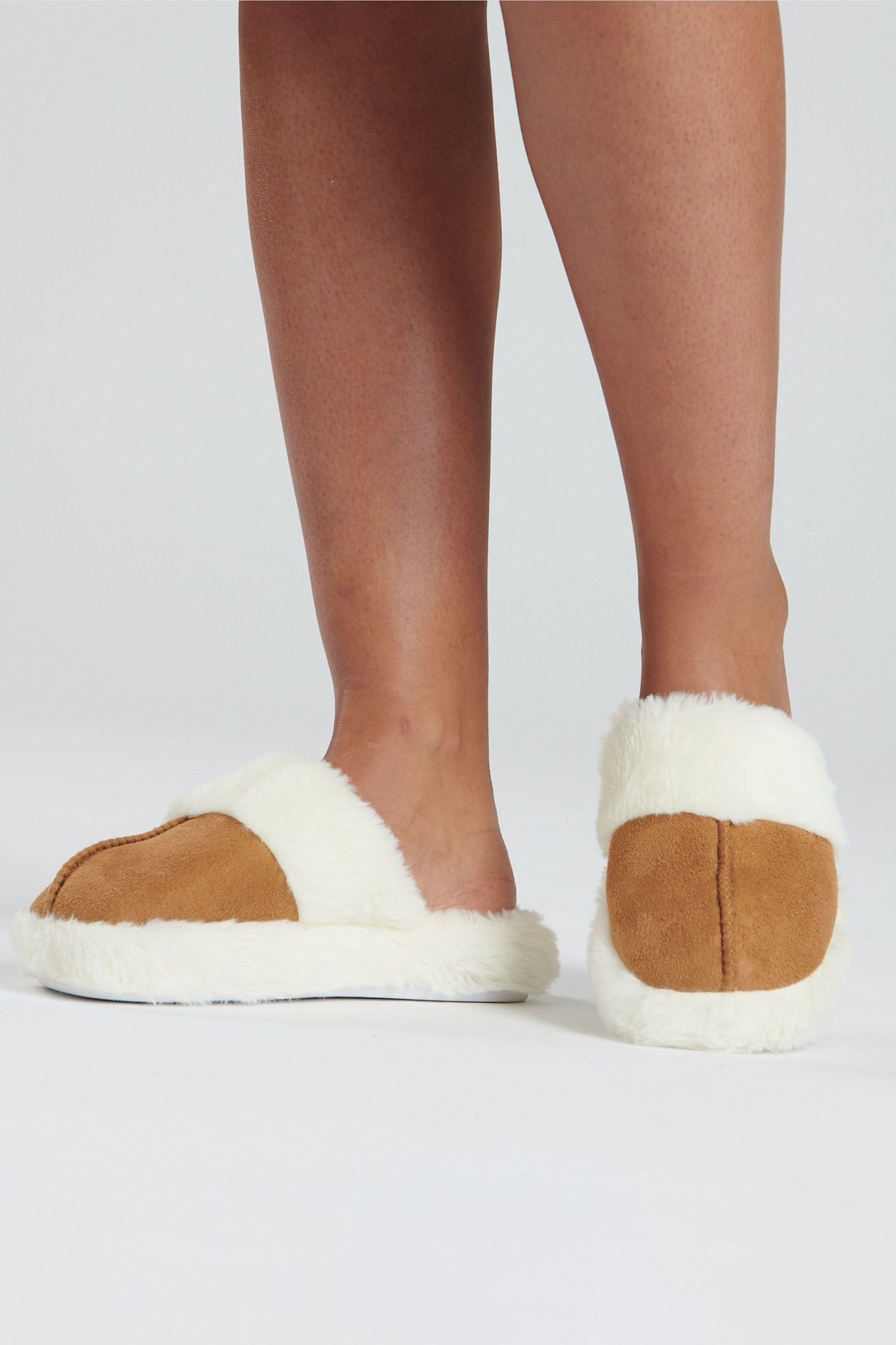 Fuzzy slippers near deals me