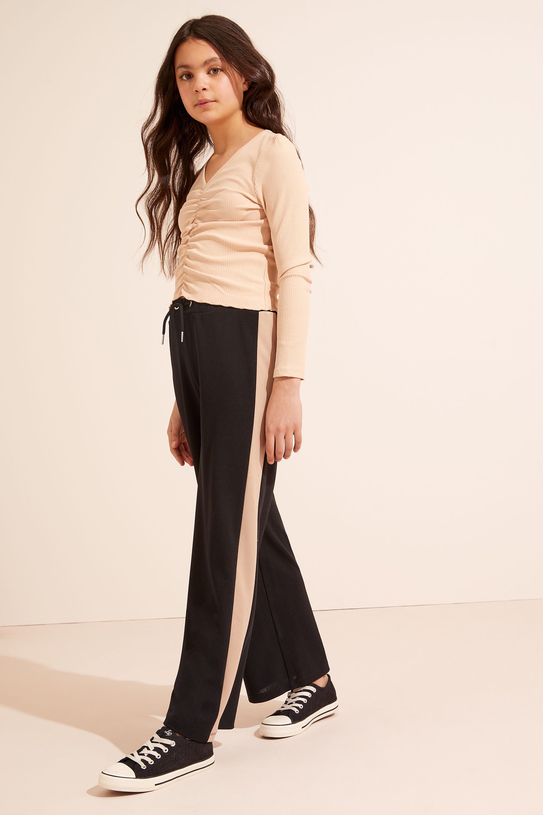 Black side outlet stripe trousers