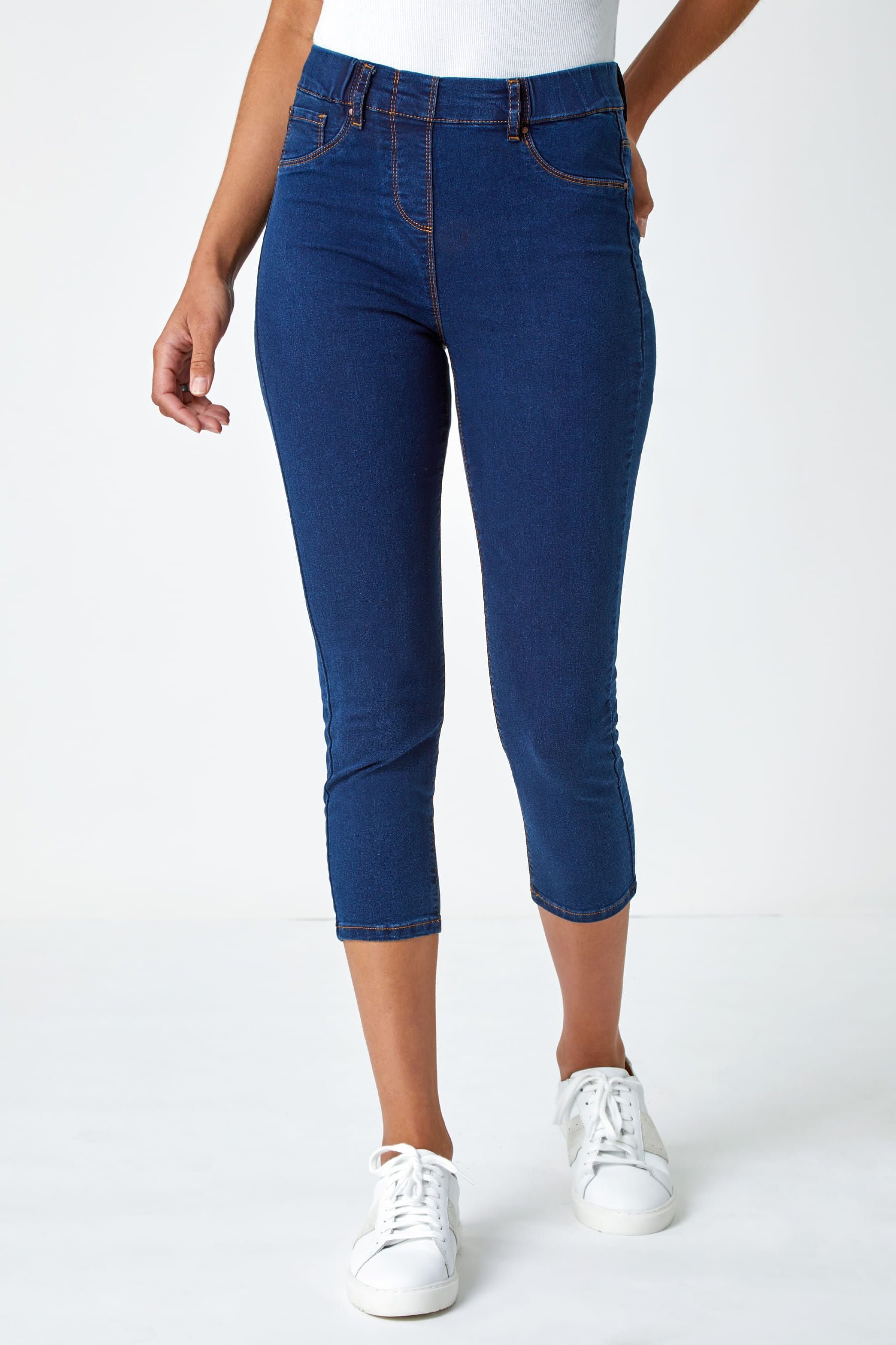 Dark blue ankle grazer jeans top