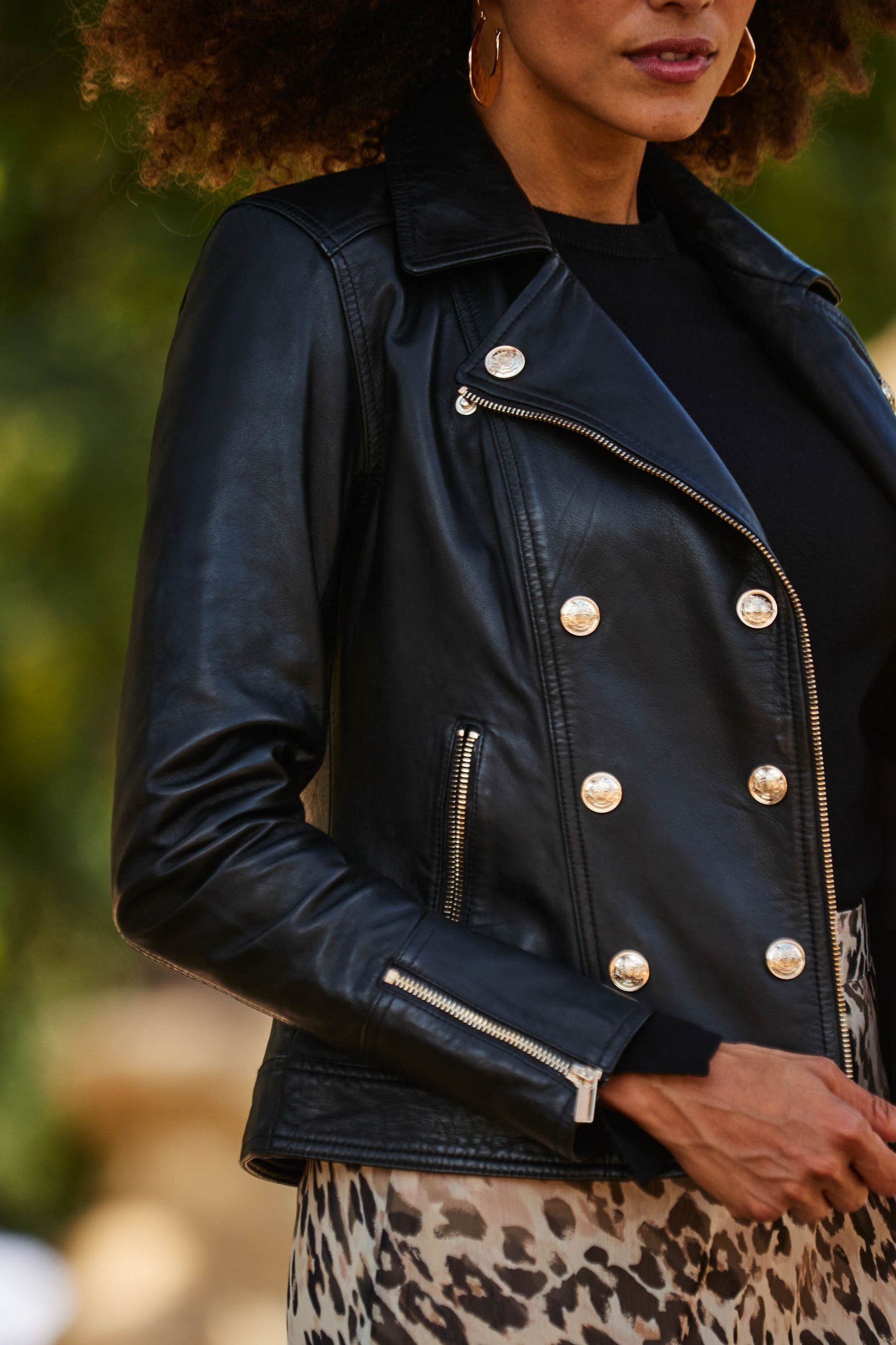 Black leather jacket with gold buttons top