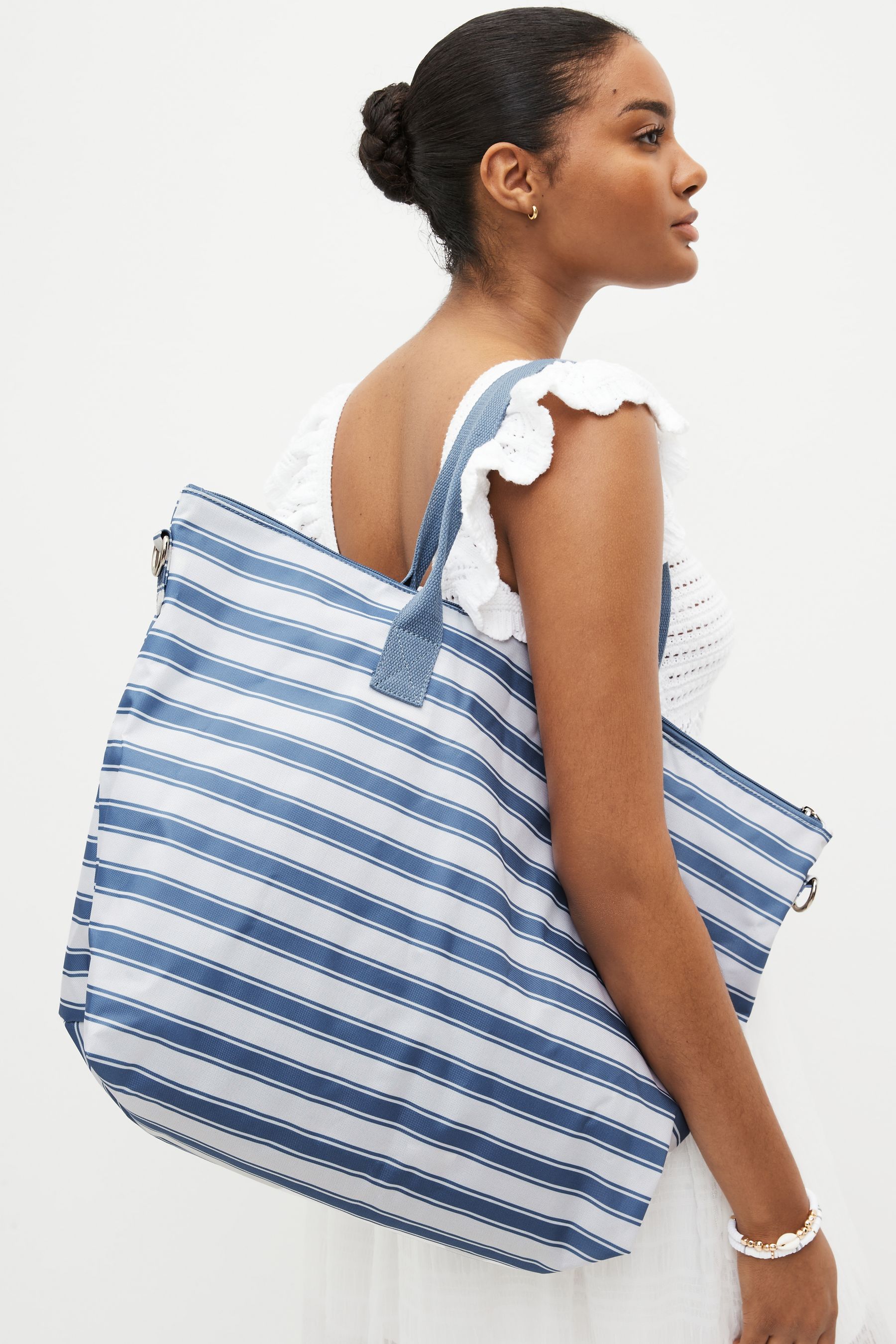 Blue and white outlet striped bag next