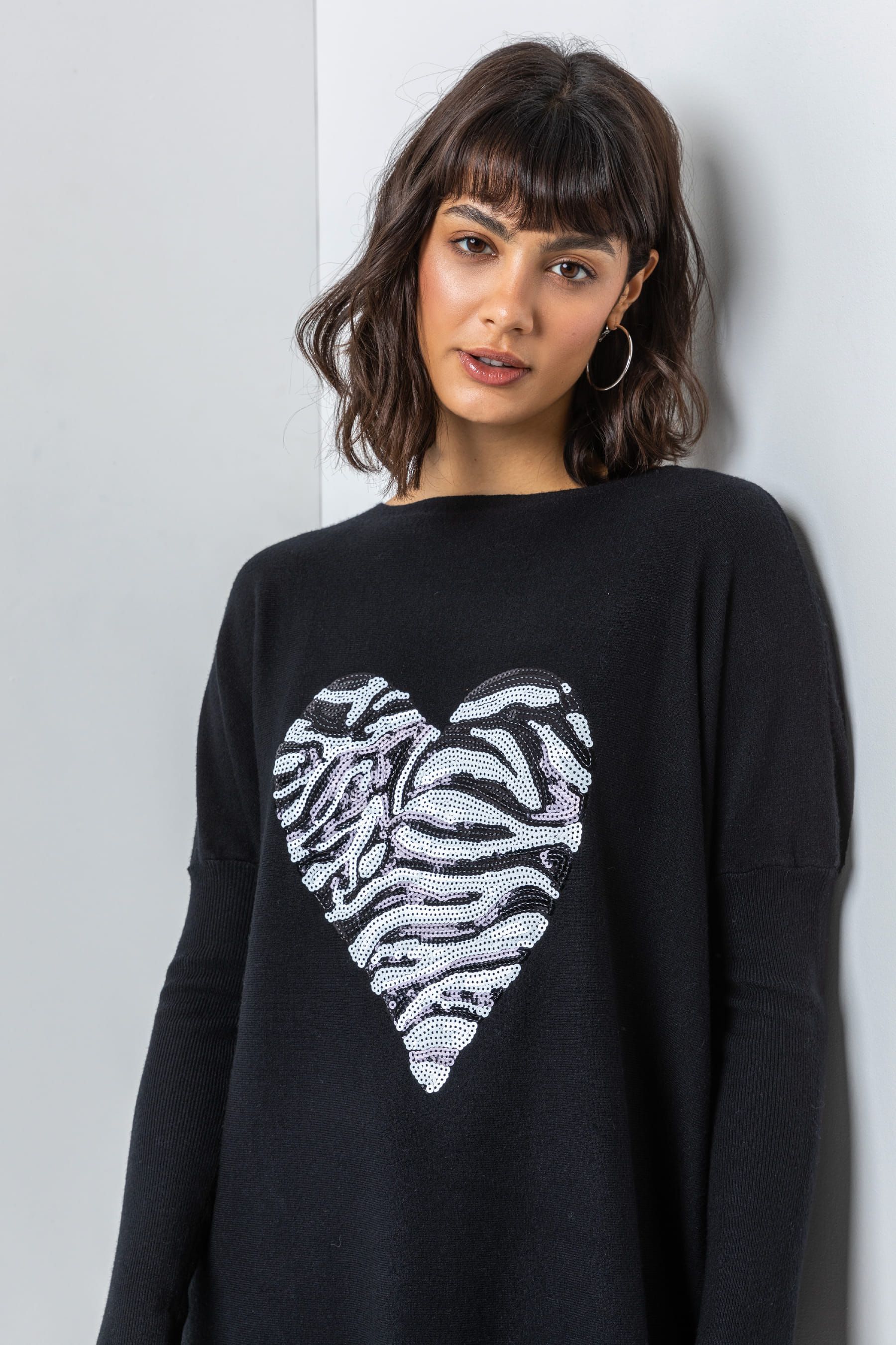 Buy Roman Black Animal Sequin Heart Long Jumper from the Next UK