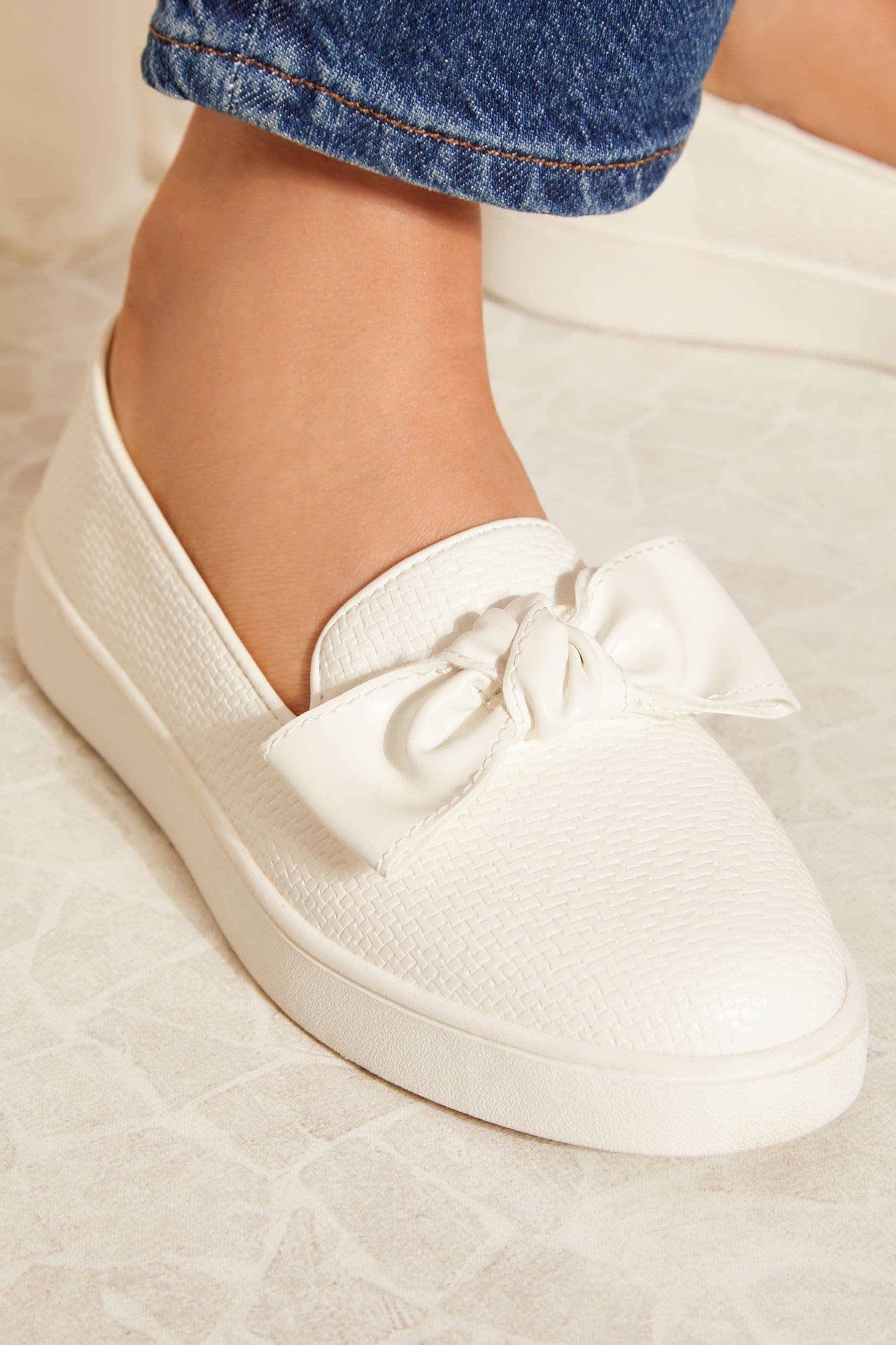 Bow slip ons online
