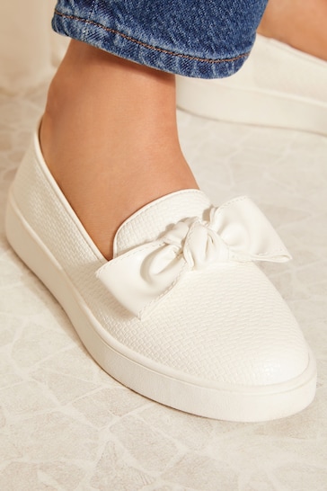 Friends Like These White Wide Fit Faux Leather Bow Slip On Trainers