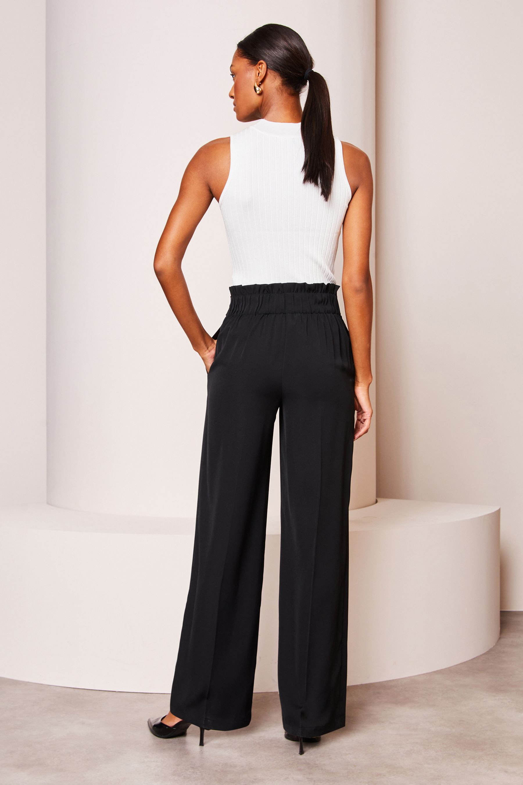Black belted wide leg trousers top