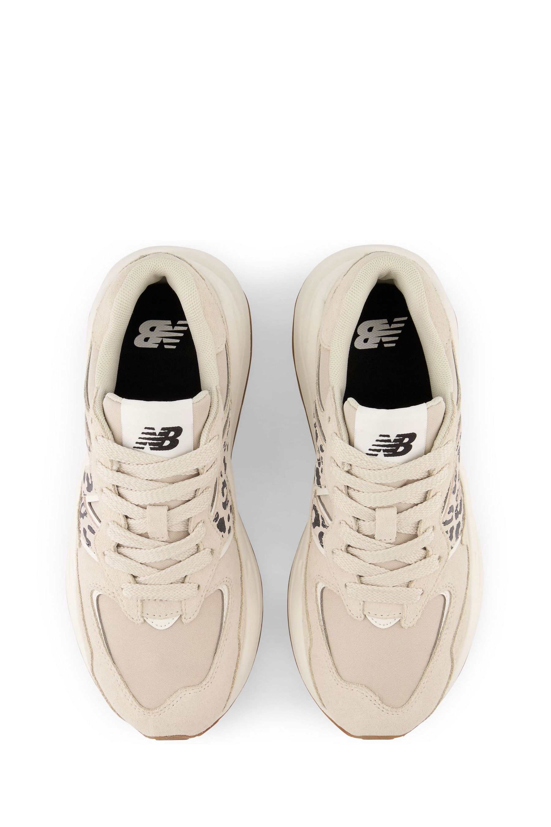Beige new balance trainers top