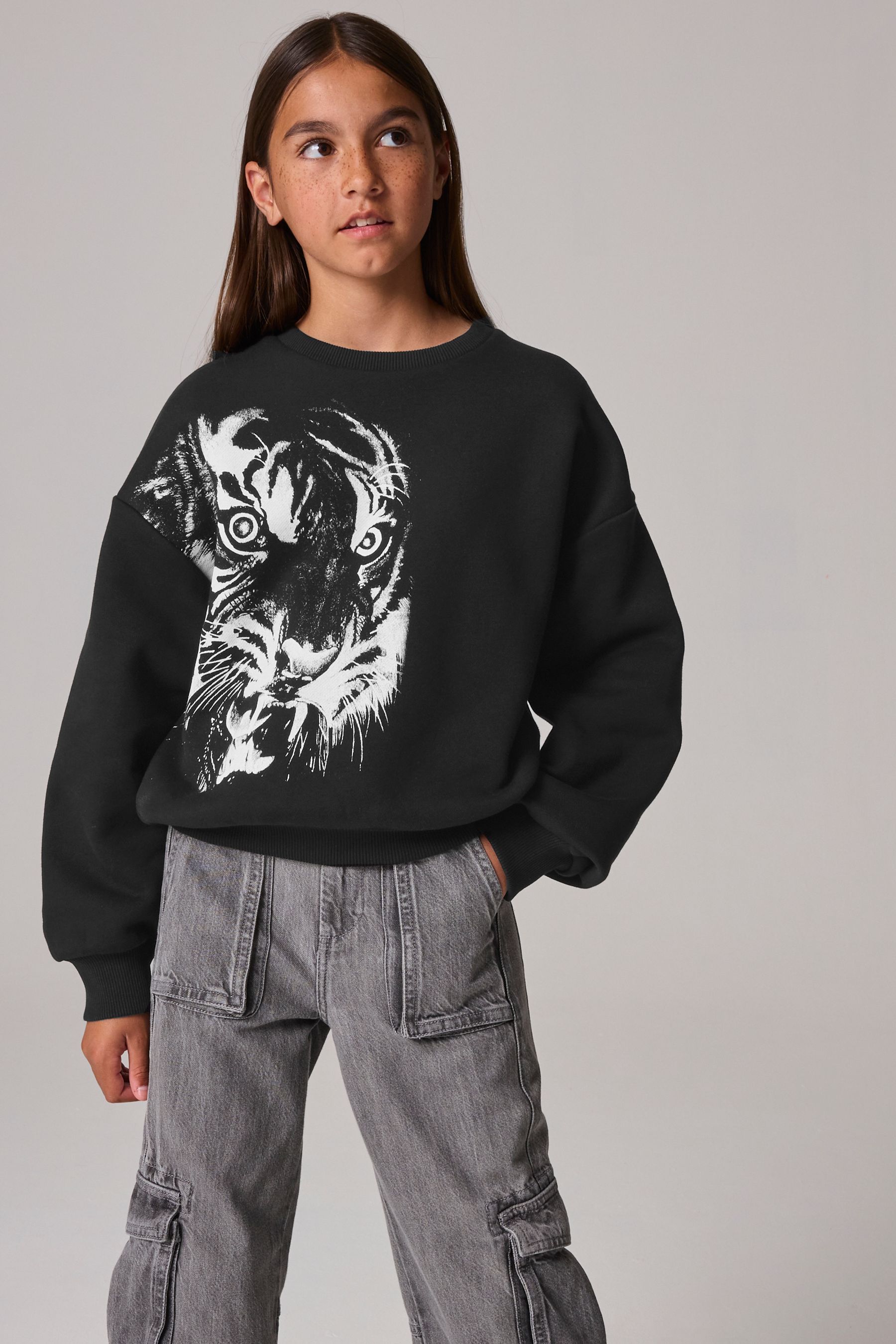 Buy smALLSAINTS Black Turin Tiger Girls Cygni Oversized Graphic Sweatshirt from the Next UK online shop