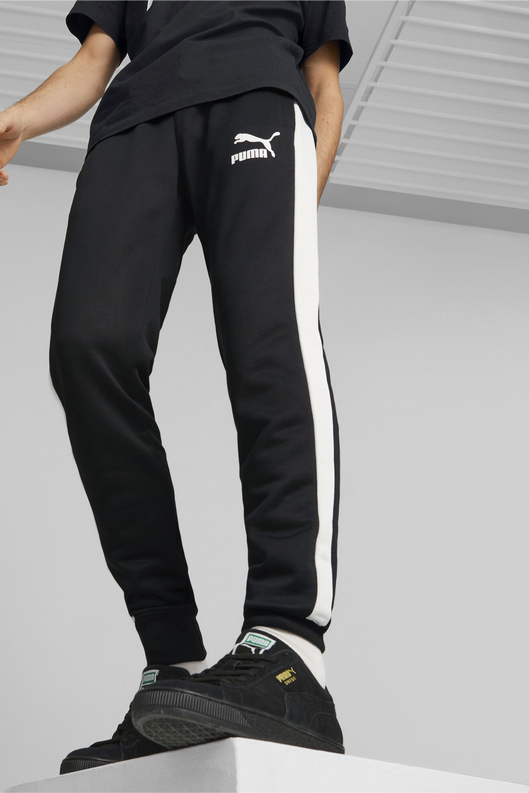 Buy Puma Black Iconic T7 Men s Track Joggers from the Next UK