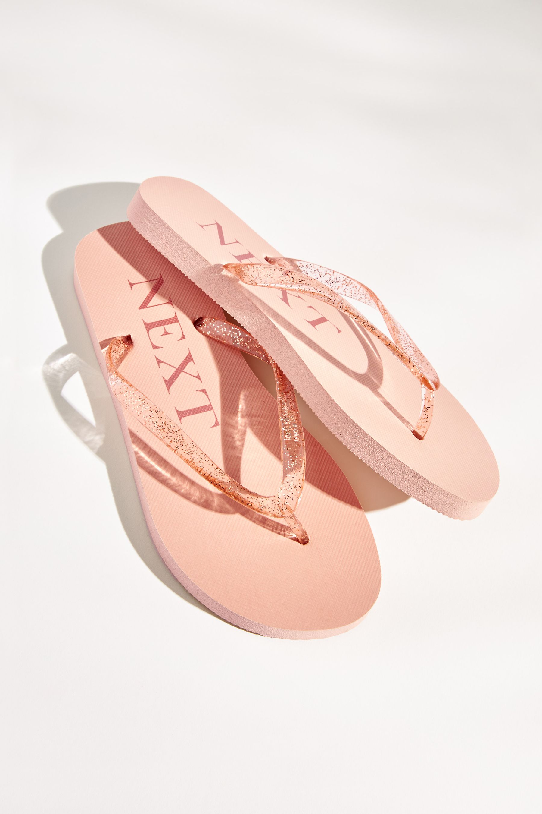 Blush pink flip shop flops