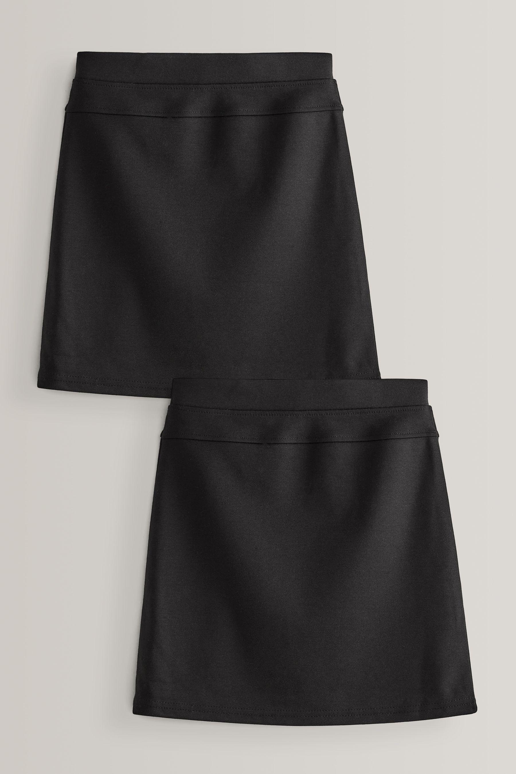 Black tube skirts for school shop