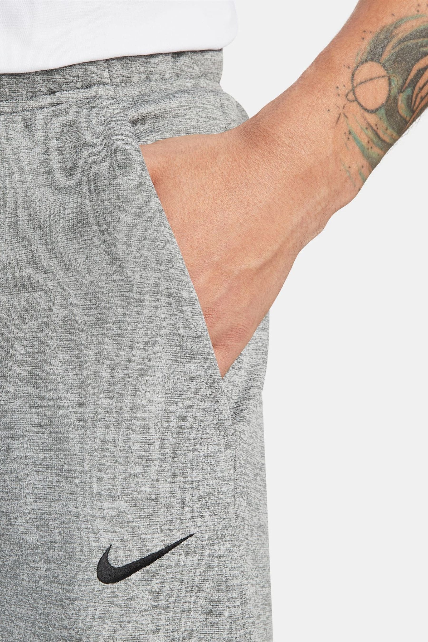 Grey nike sweatpants with shop black logo