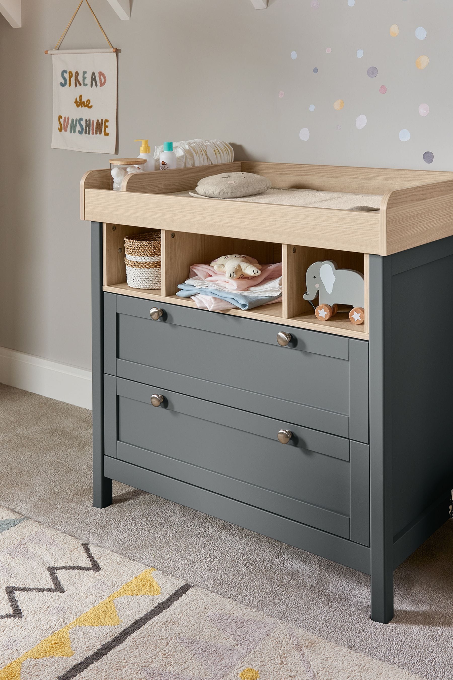 Grey changing table with 2024 drawers