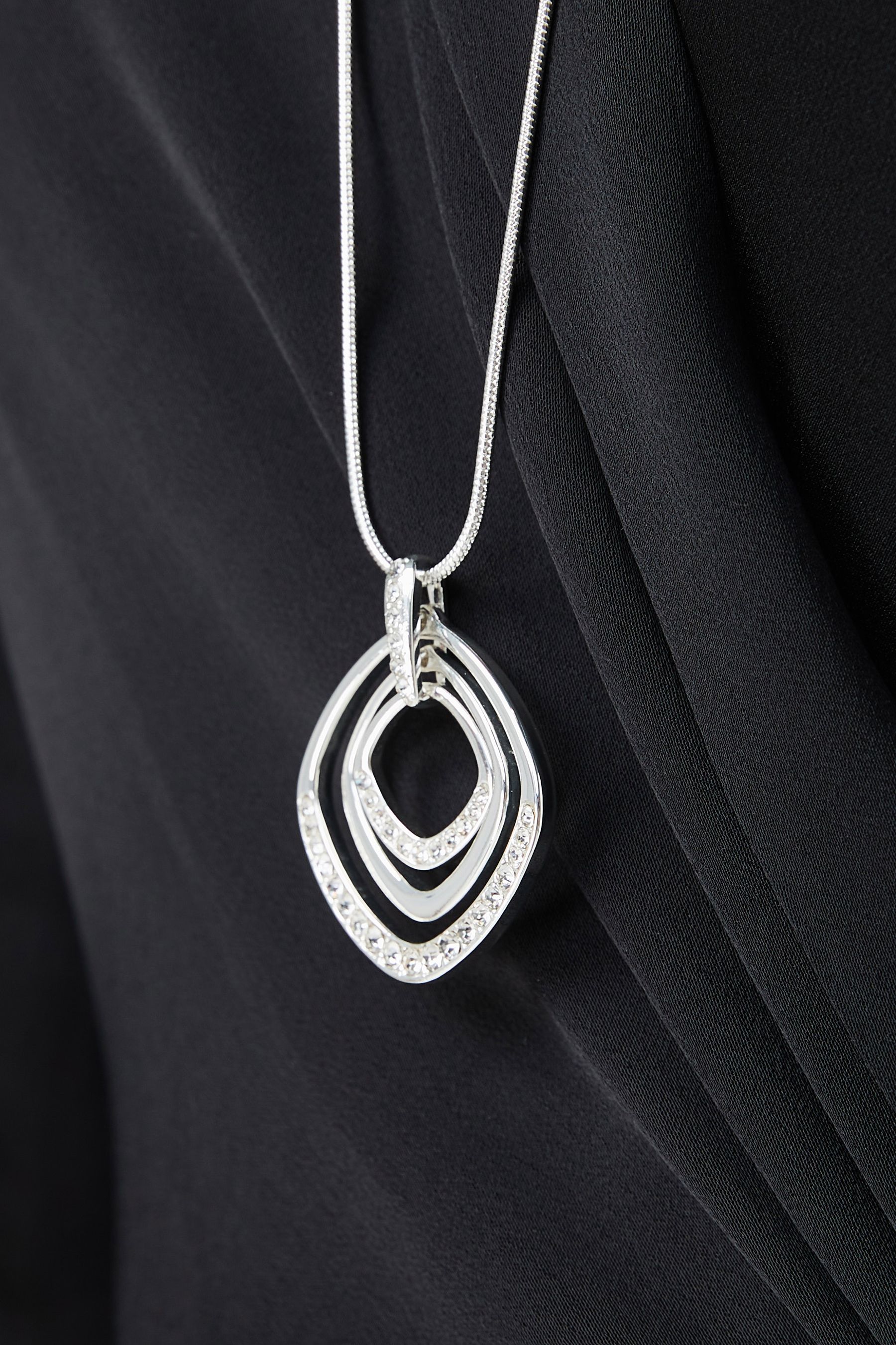 Long silver sparkly necklace top