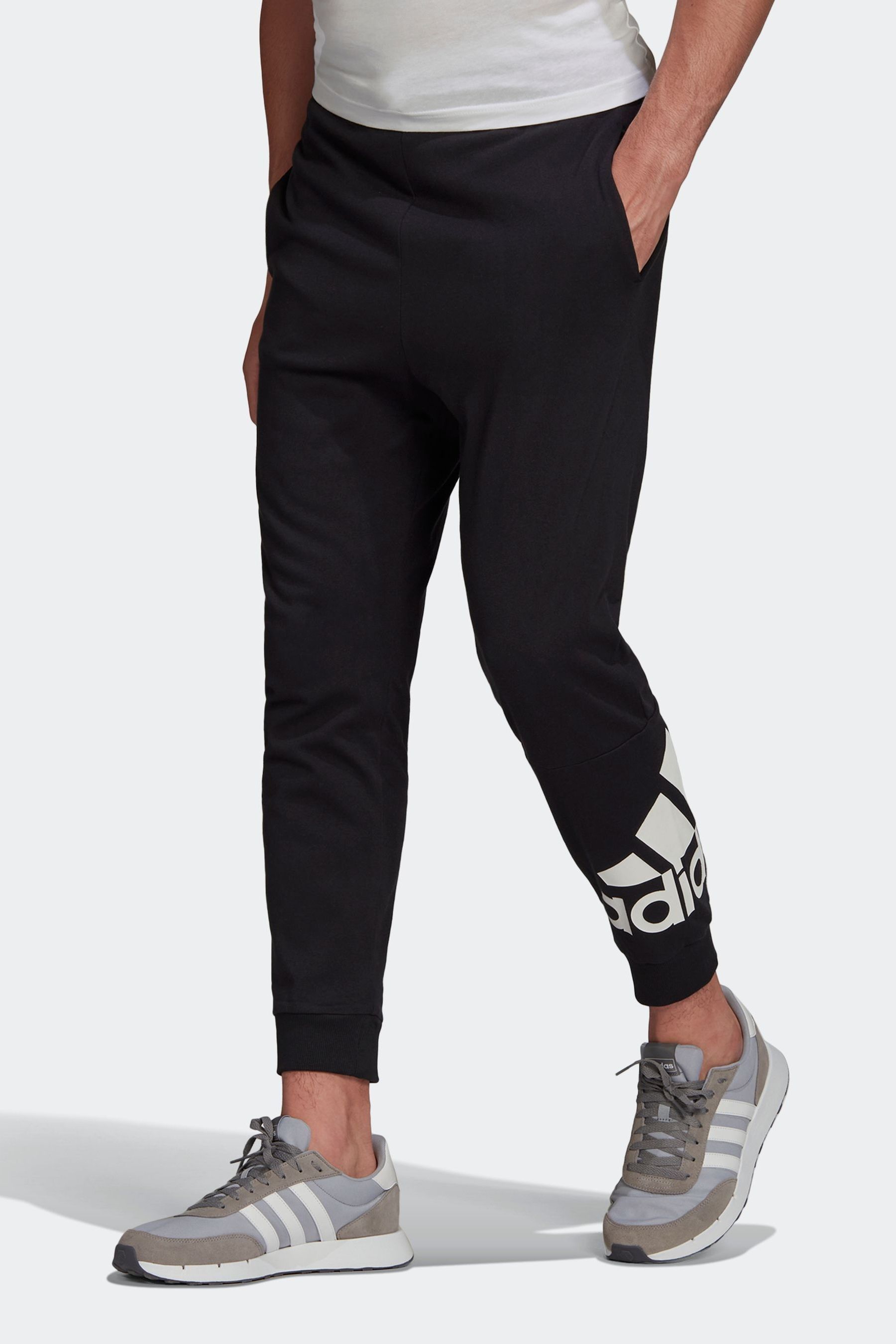 Men's adidas essential online logo jersey pants