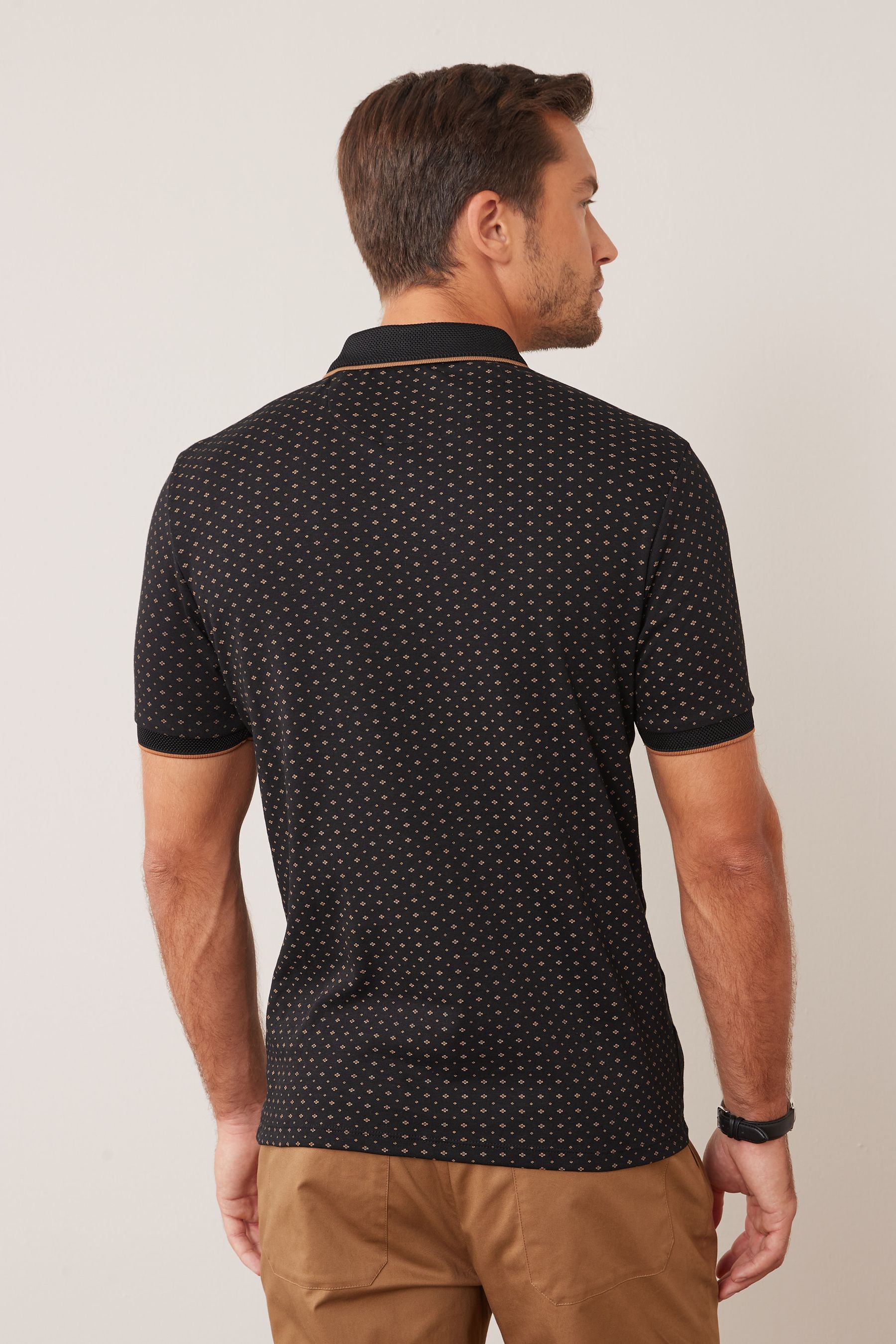 Mens black and online gold polo shirt