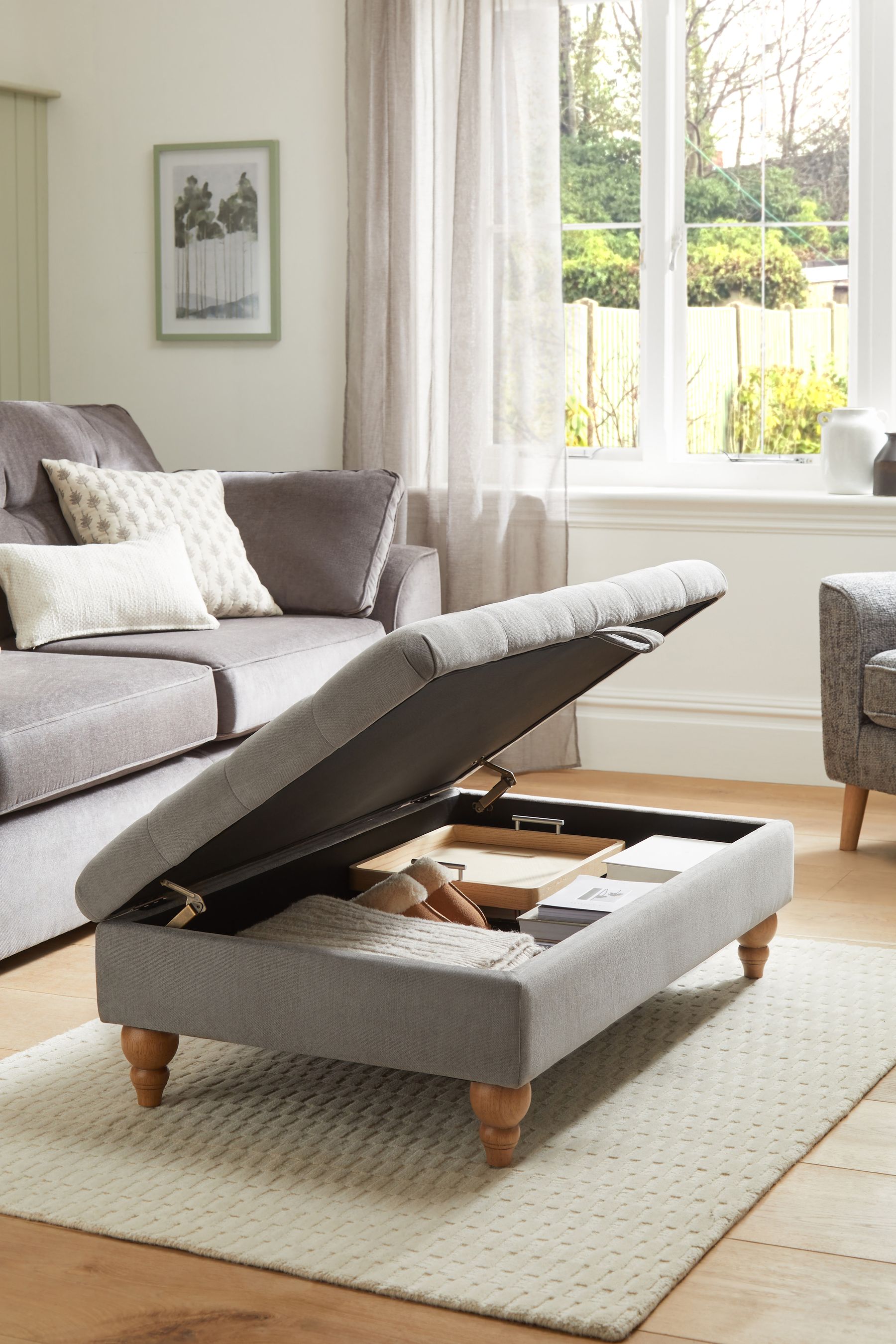 Buttoned footstool with outlet storage