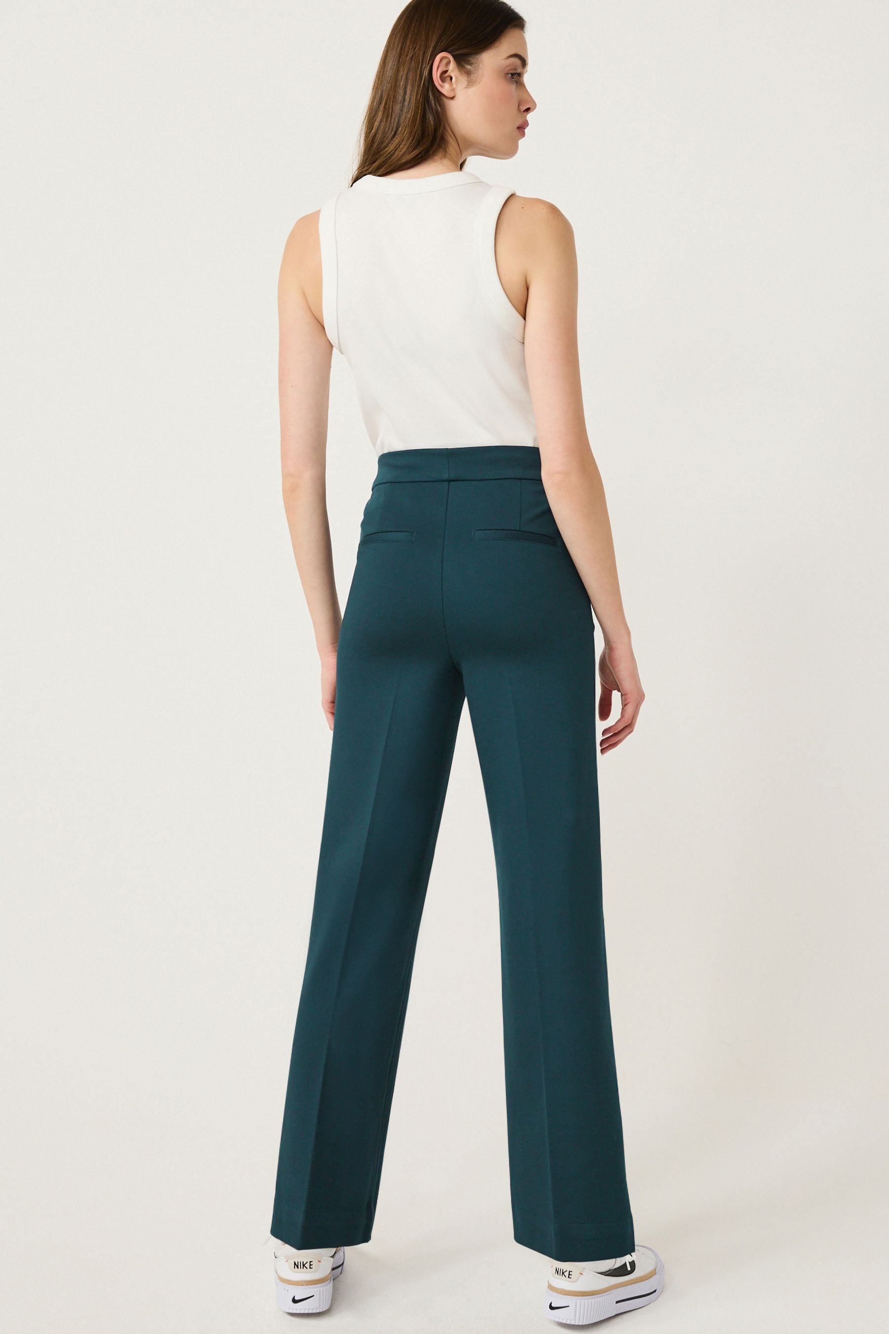 Teal colored pants online