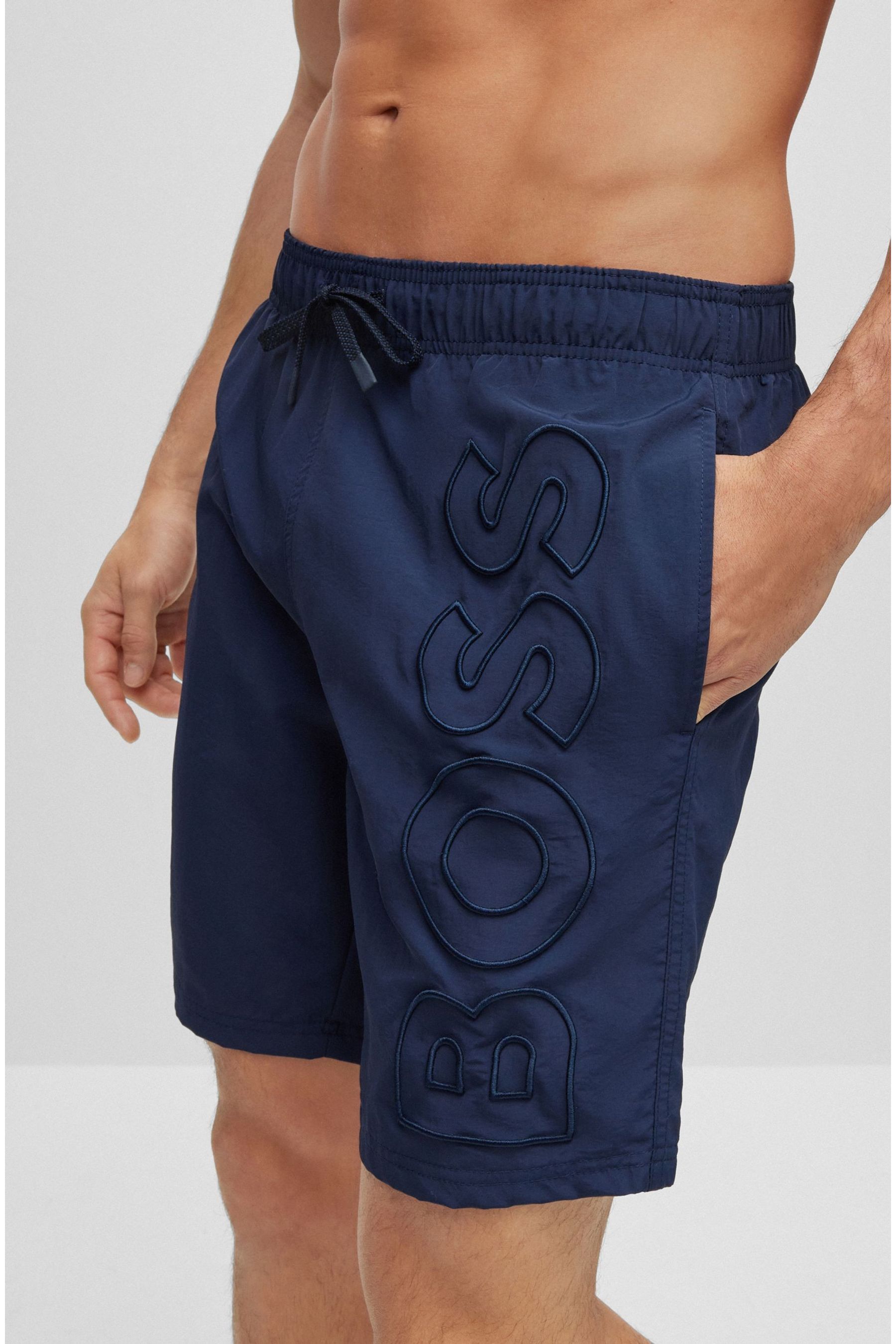Whale swim trunks store