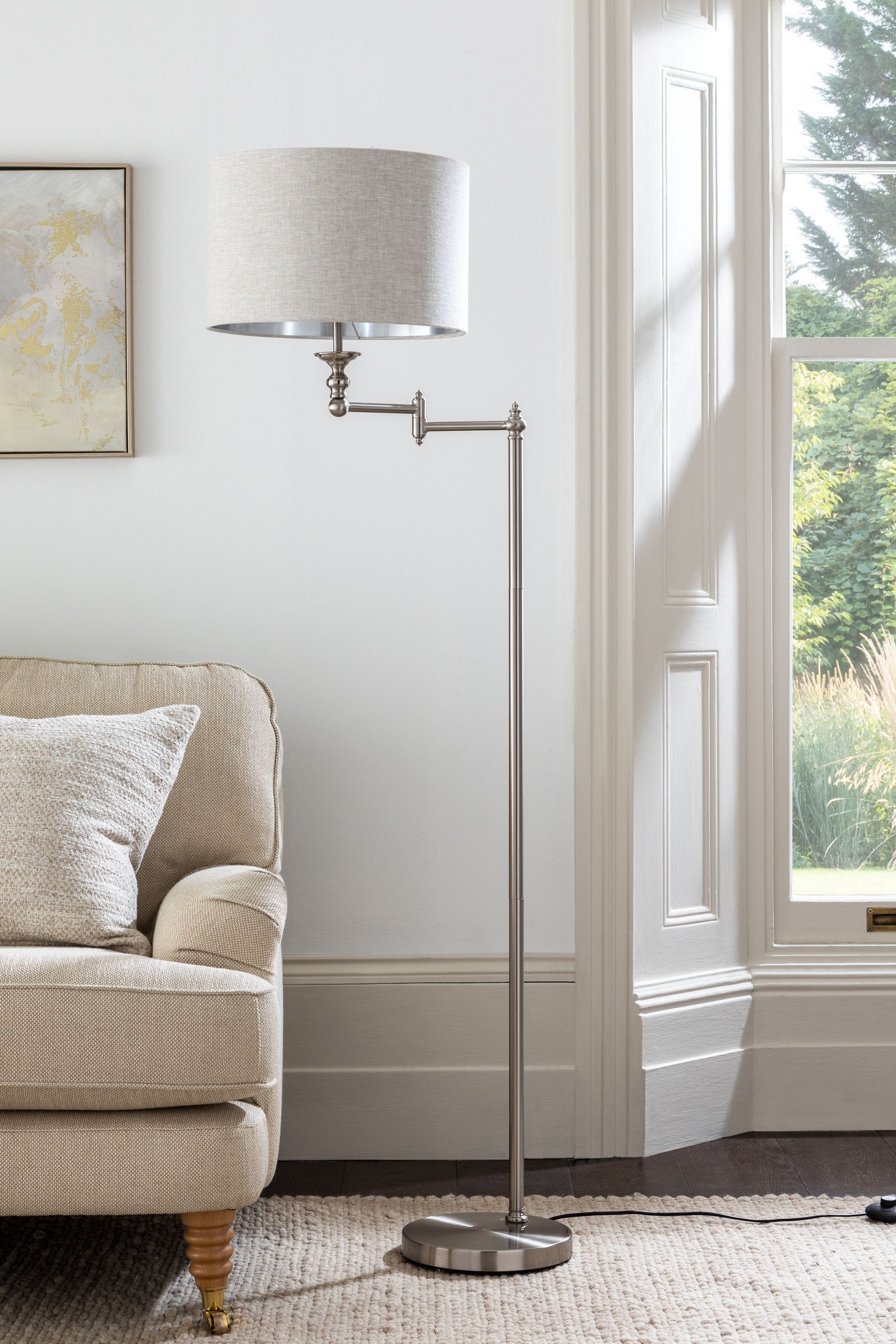 Brushed nickel swing store arm floor lamp