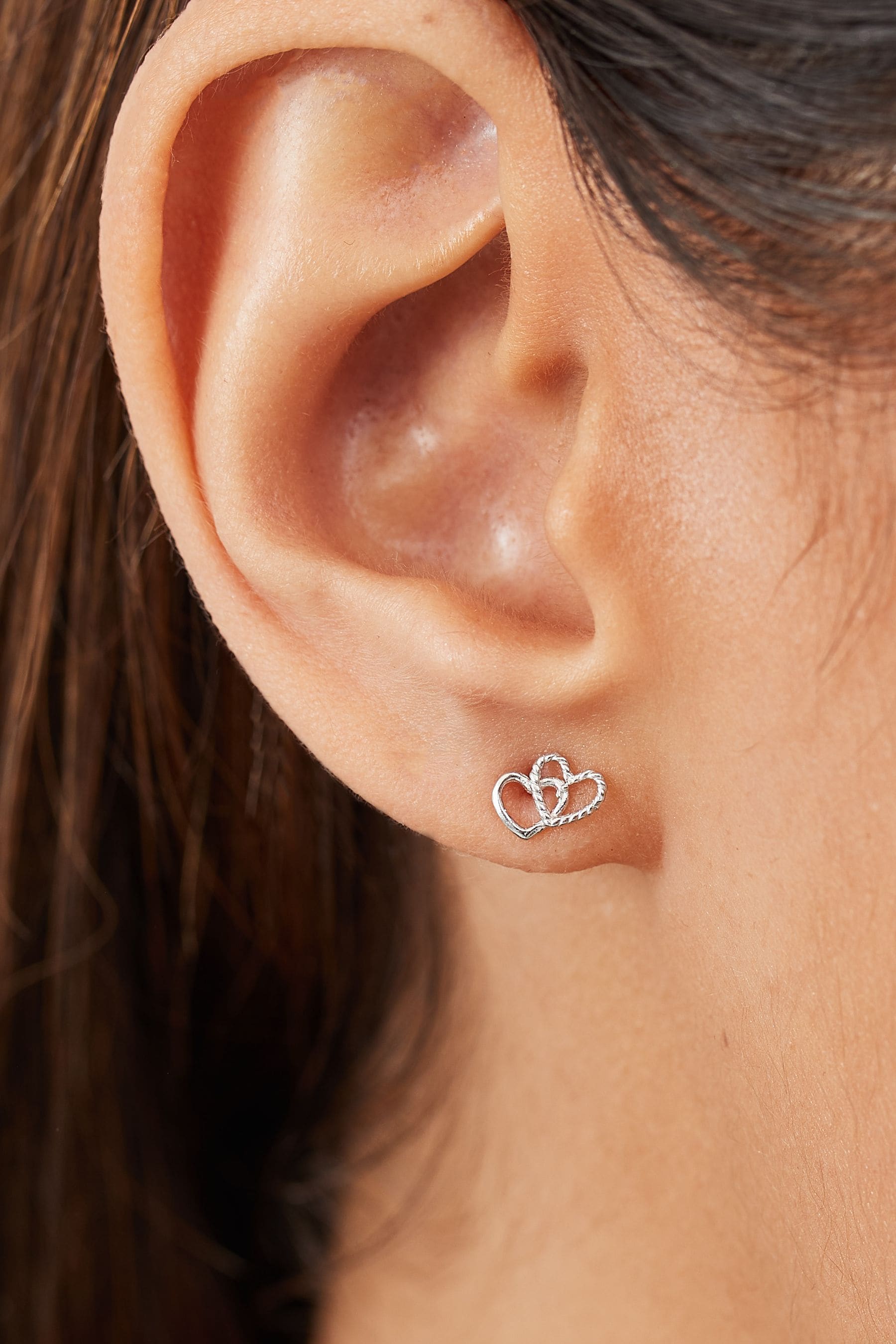 Interlocking heart best sale earrings