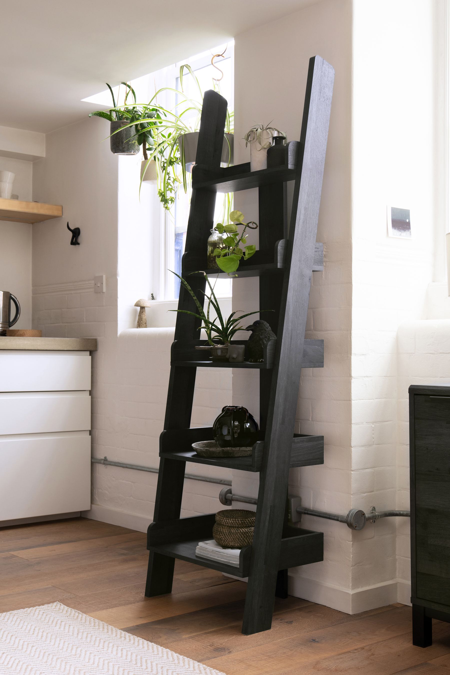 Black ladder shop shelf with drawers