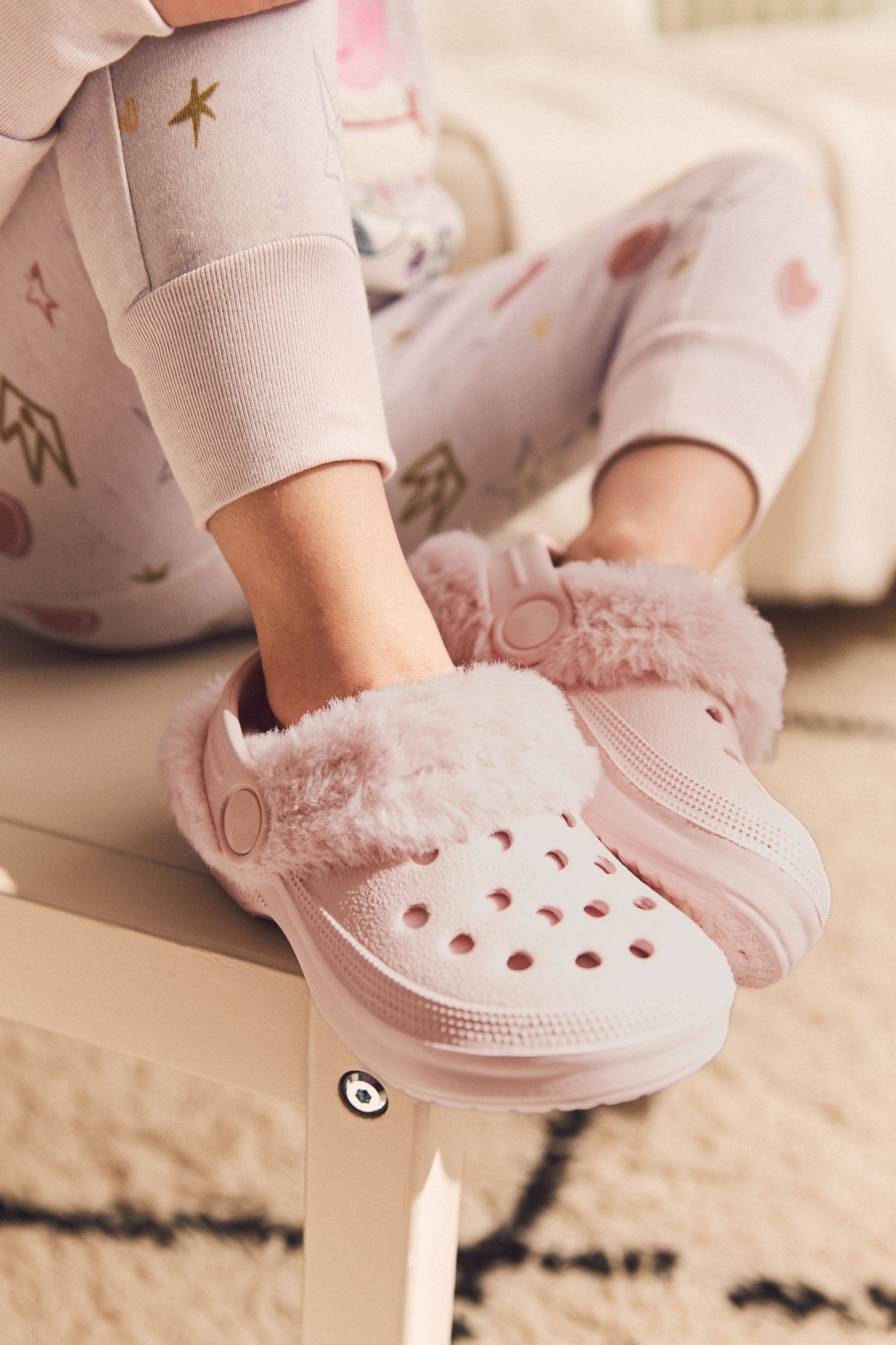 Crocs store pink slippers