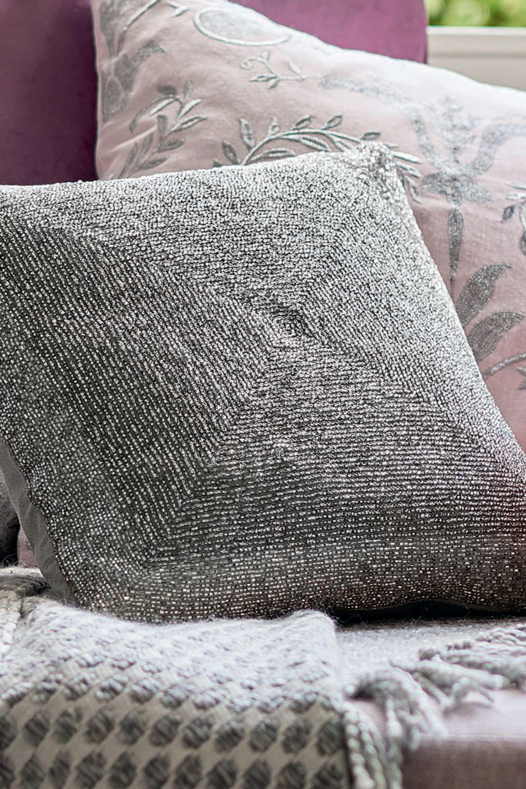 Grey shop beaded cushion