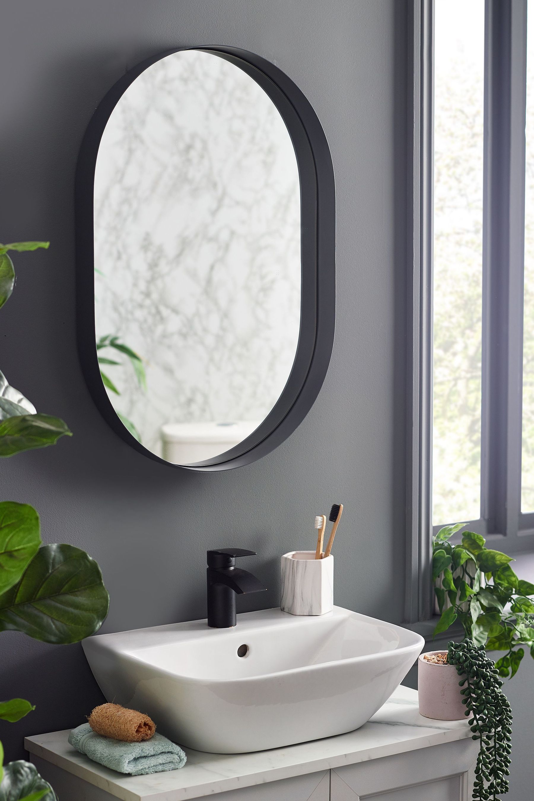 Black oval sales medicine cabinet