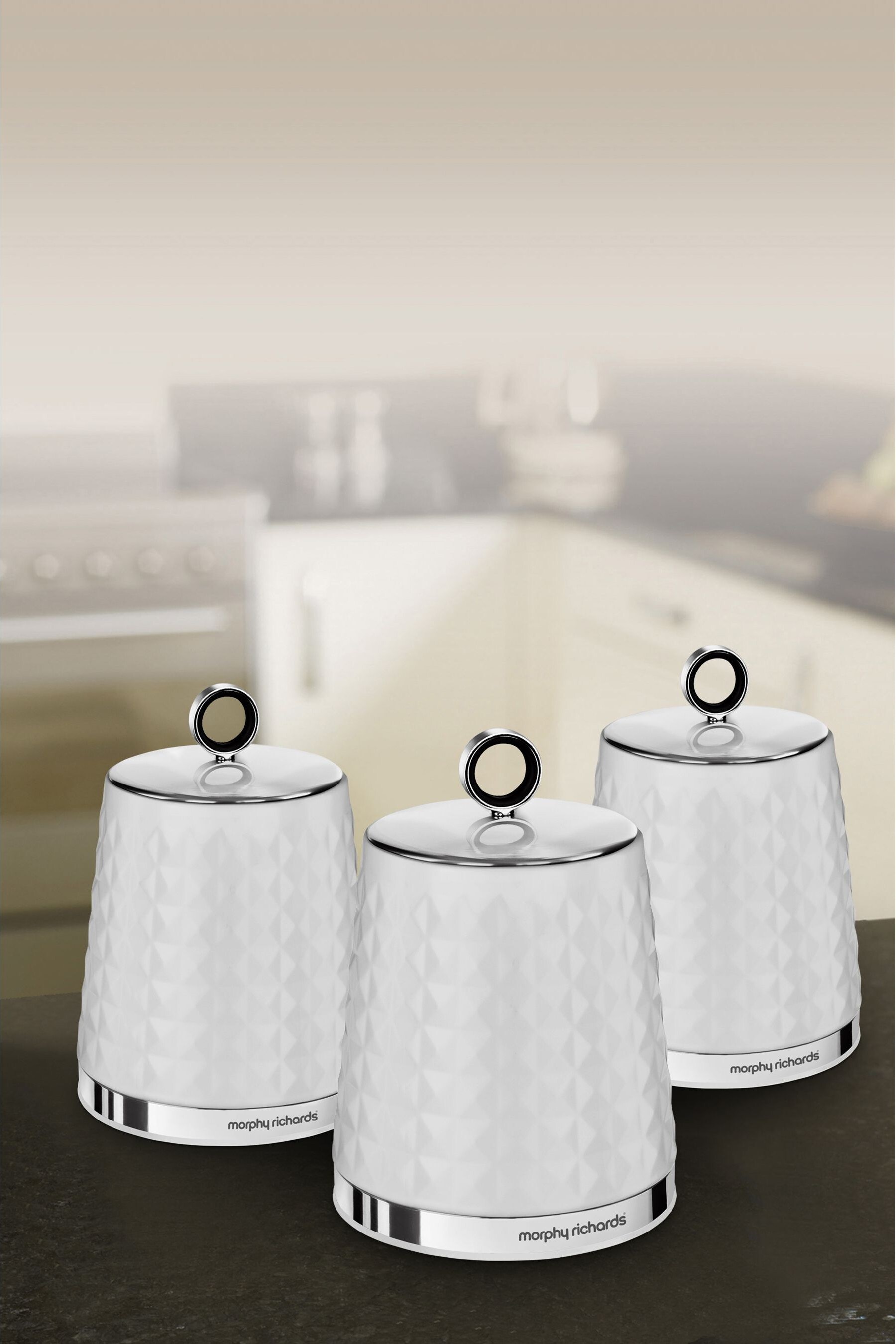 Silver tea coffee sugar shop canisters next