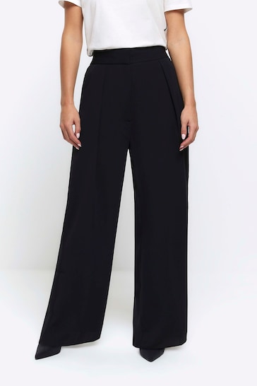 Buy River Island Black Petite Wide Leg Pleated Trousers from the Next ...